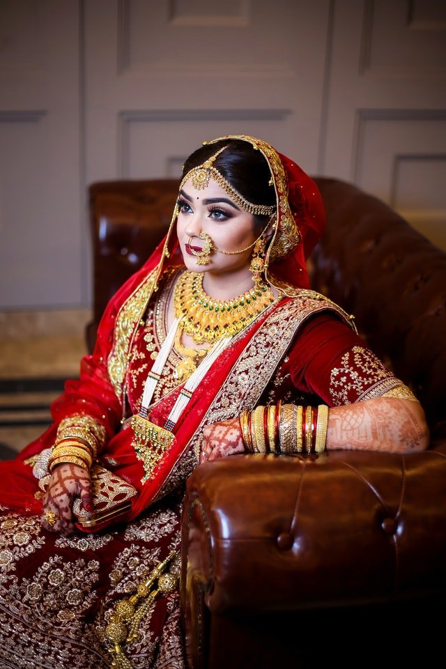 woman in red sari dress